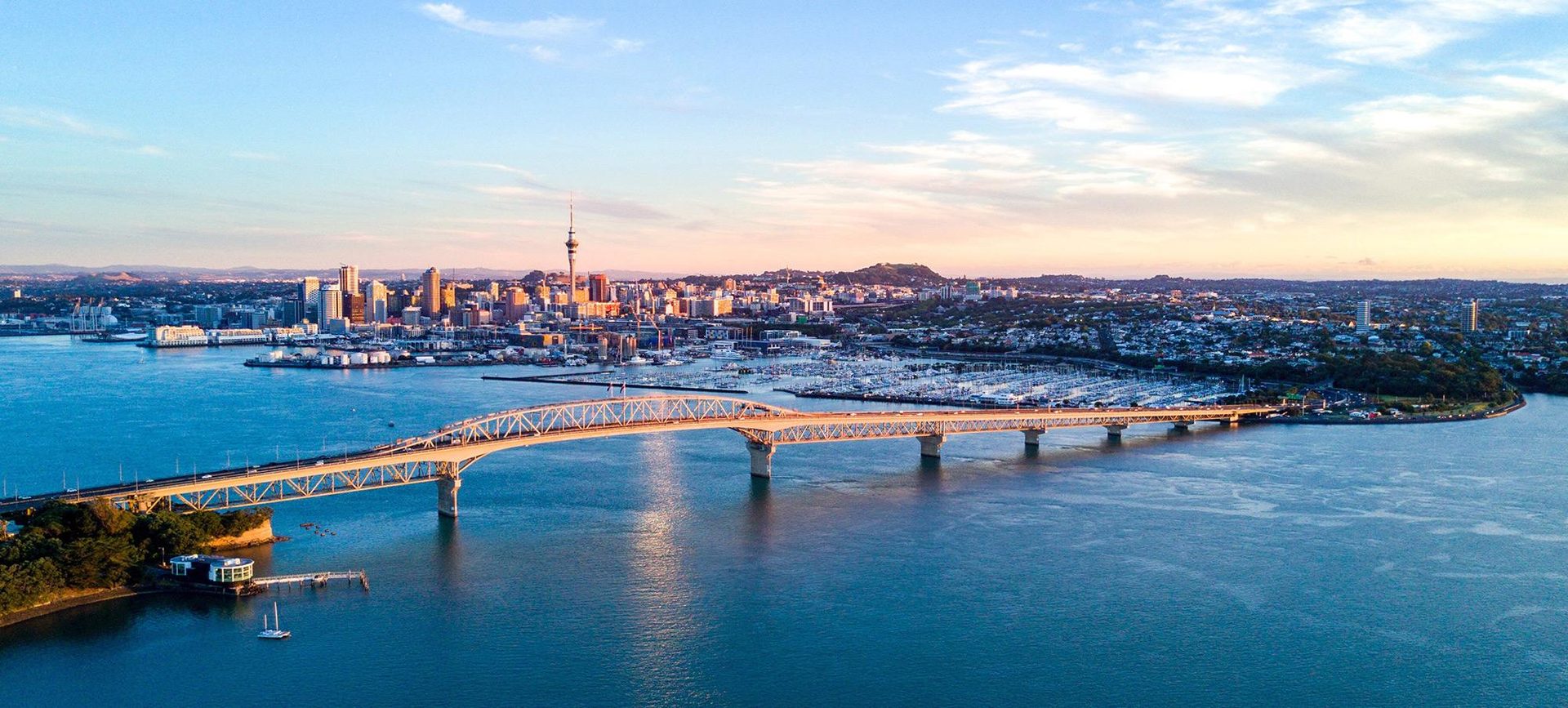 Aerial view of the Auckland Harbour Bridge, the city skyline and the North Shore